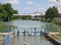 Another common sight is a pipeline, conveyor or footbridge over the canal, serving a factory.