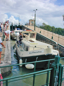 Two northbound boats have crossed the bridge and have descended through the bridge-level lock into this lower lock.