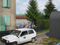 The VNF lockkeeper serves many locks from his little white car, here he chats with the family next to lock 25 at Velaines.