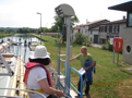 There are two control rods in each lock, blue to operate the lock and red to stop in case of emergency.  (This photo is out of sequence, to show the rods clearly.)